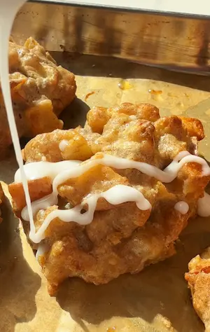 Healthy sugar-free apple fritters on a baking tray