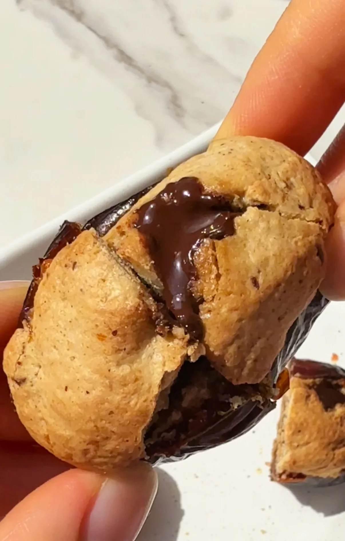 Air fried cookie dough stuffed medjool dates with melted chocolate chips on top