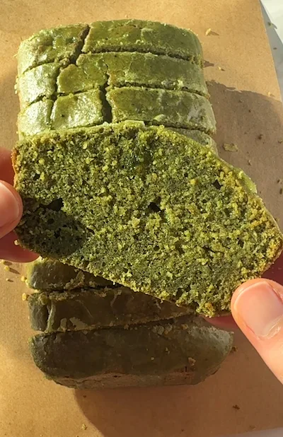 matcha icing drizzled on top of a healthy mini matcha loaf cake